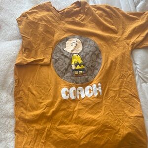 Coach Tee unisex runs large